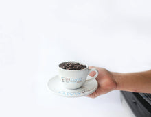 Load image into Gallery viewer, A person holding a cup of Degayo Coffee beans 	 	 	
